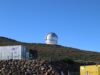 PRIMA Has a Scientific Case. NASA Still Has to Prove It Can Build the Telescope A large observatory dome sits on a hill beneath a clear blue sky, ideal for astronomy enthusiasts.