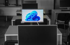 The Windows Update That Broke the Infrastructure Beneath Windows A contemporary office setup featuring computers on desks with modern flat screens.