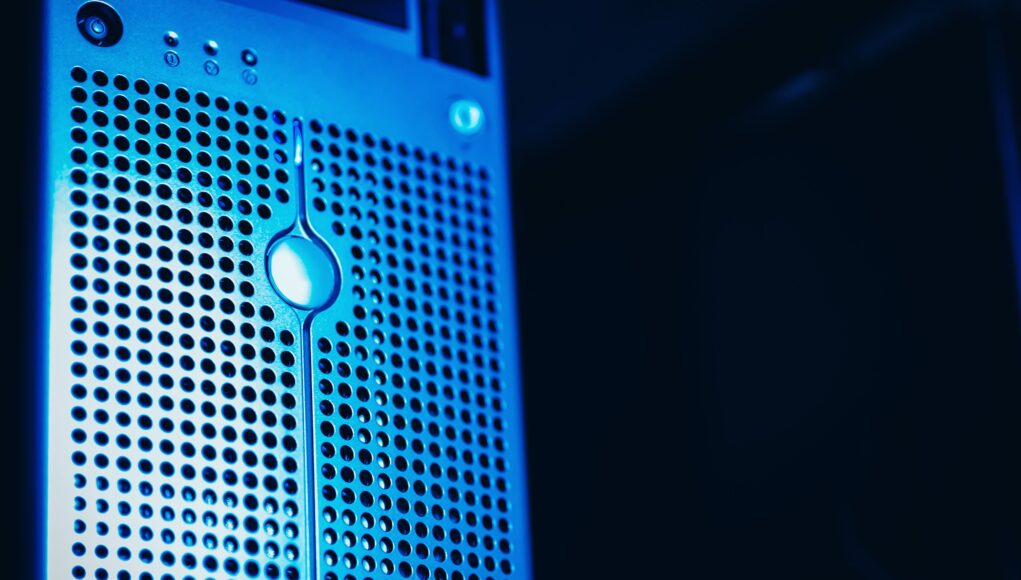 pexels-photo-37730211 Modern server rack with blue lighting in a secure data center environment.