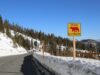 The Roadless Rule’s Next Life Will Be Decided One Forest at a Time A caution sign warns drivers on a snowy mountain road in Mammoth Lakes.