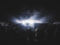 Amazon Music Live Is Turning the Postgame Into a Music Funnel Dynamic concert scene with an energetic crowd at night in a London stadium.