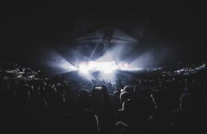 Amazon Music Live Is Turning the Postgame Into a Music Funnel Dynamic concert scene with an energetic crowd at night in a London stadium.