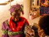 A Rural Clinic’s Backup Plan Is Not the Same as Backup Care A smiling woman in traditional clothing having her blood pressure measured by a healthcare worker.