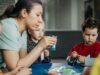 Indiana’s Child-Care Waitlist Is Becoming a Local Government Problem Preschool children enjoy a hands-on artistic activity with their teacher indoors.