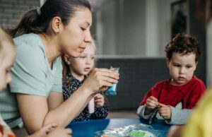 Indiana’s Child-Care Waitlist Is Becoming a Local Government Problem Preschool children enjoy a hands-on artistic activity with their teacher indoors.