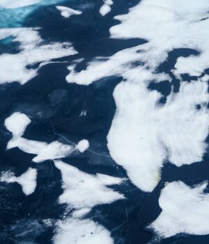 pexels-photo-8704127 Aerial view of striking ice patterns on a frozen lake in Norilsk, Russia. Captivating and abstract.