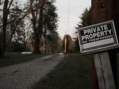 The Government Can Open a Gate. It Cannot Manufacture a Hunt. A 'private property, no trespassing' sign on a wooden post along a rural road in Ohio.