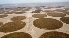 Methane Satellites Passed Their Test. Their Blind Spots Matter More Than the Victory Aerial shot of circular irrigation patterns in an arid desert landscape.