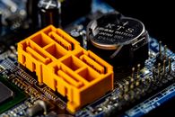 The FCC Is Regulating the Chip Inside the Device, Not Just the Brand on the Box Close-up view of a motherboard with visible electronic components and connectors.