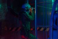 Astronauts’ Hearts Adapted to Six Months in Space. Mars Is Still a Different Test. Astronaut in a futuristic setting wearing a space suit, exploring a lit indoor environment.