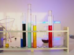 Frankenstein Was Never Really About a Monster Vibrant test tubes filled with liquids in a modern lab setting, showcasing scientific exploration.