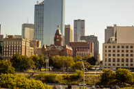 DOJ Has Chosen Its “Model Cities.” Now It Has to Explain the Model. Scenic view of Dallas skyline featuring the Old Red Museum and skyscrapers.